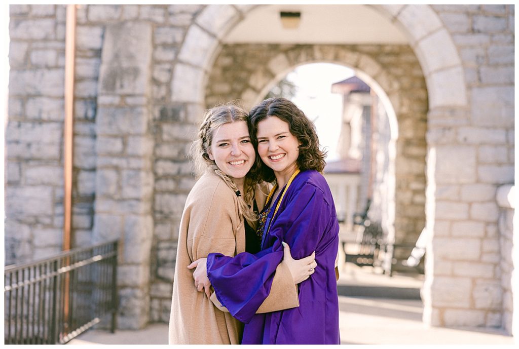 Meg in Cap and Gown on James Madison University Campus